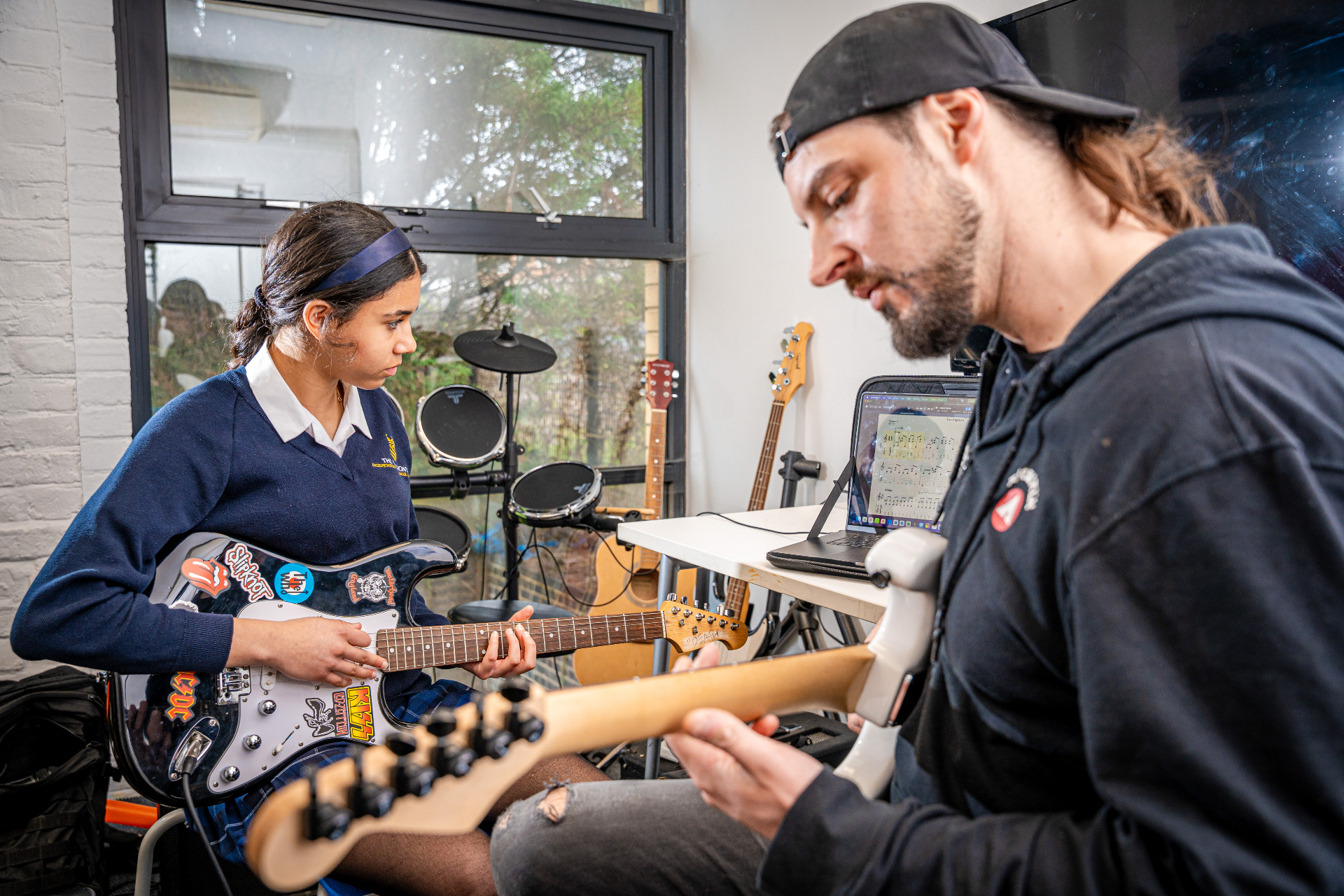 A student receiving a one-to-one electric guitar lesson at The Chalfonts